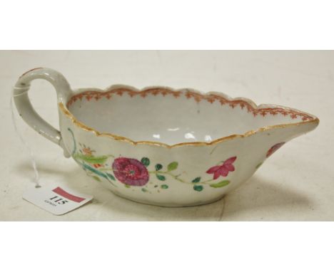 An 18th century porcelain sauce boat of oval form with scalloped edge and enamel decoration