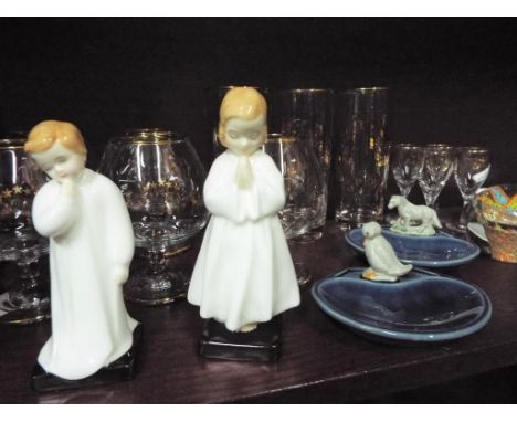 A mixed lot to include two Royal Doulton figurines, two Wade trinket dishes, two glass paperweights, a Royal Doulton trinket 