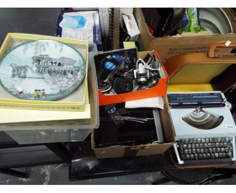 Four boxes containing  a mixed lot to include Asian style collector plates, boxed, a quantity of fishing reels and Boyz Toys 