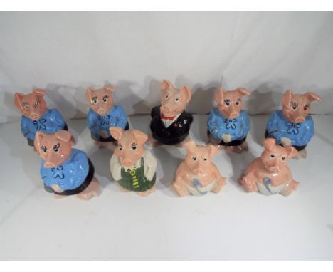 Nine ceramic Nat West pigs by Wade