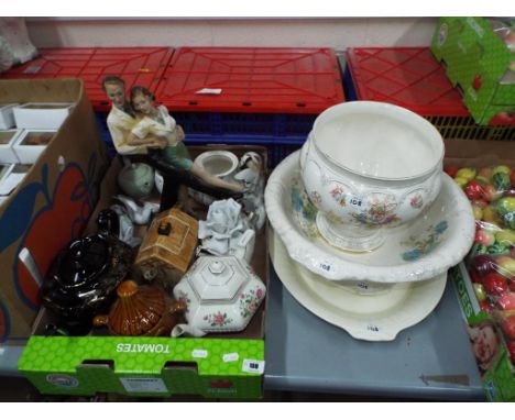 A mixed lot of ceramics to include novelty teapot, jardiniere by Devonshire Ware, ceramic meat plates, a large painted plaste