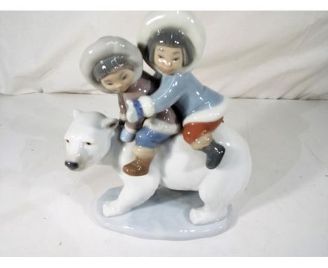 Lladro - a retired figure depicting a polar bear with two Eskimo children riding, 5353, 17 cm (h) excellent - Est £40 - £60