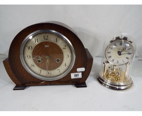 A good quality mantel clock Arabic numerals to the dial, marked Smiths Enfield Made in England, with pendulum and a further d