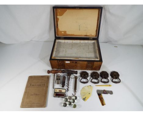 A vintage wooden inlaid box containing a quantity of collectables comprising corkscrews, drawer handles, small brass Salter s