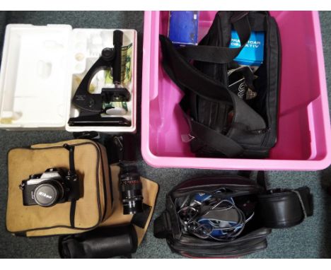 A good lot to include a quantity of photographic equipment comprising a Sony camcorder in case, Nikon camera in case, camera 