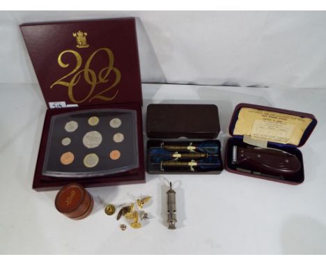 A good mixed lot to include a vintage Viceroy dry shaver, cased, a boxed set of Unicorn darts, a 2002 Royal Mint United Kingd