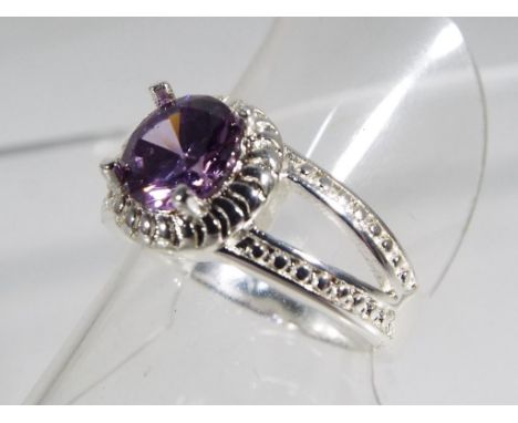 A silver ring stamped 925 set with amethyst, size N. Estimate £15 - £20