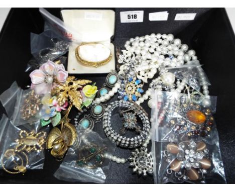 A jewellery box containing a quantity of good quality costume jewellery to include cameo brooch, a silver necklace stone set 