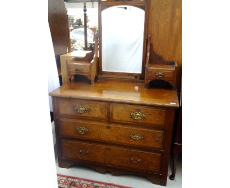 MAHOGANY DRESSING CHEST
early 20th century, with bevelled mirror held above two short over two long drawers with shaped handl