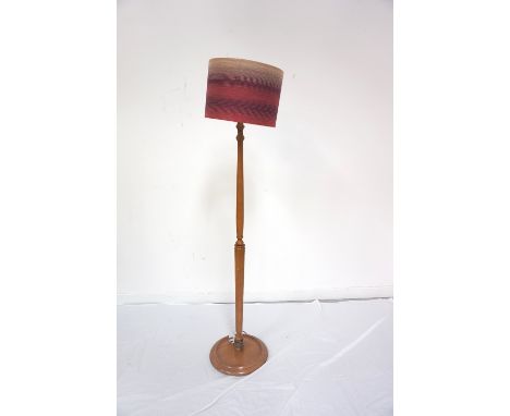 MAHOGANY STANDARD LAMP
raised on a circular base with a reeded tapering column, 138cm high, with a circular shade 