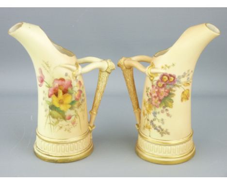 ROYAL WORCESTER - a pair of blush horn shaped jugs with floral decoration and horn handles, 1907, 16cms height NOTE:  INTENDI
