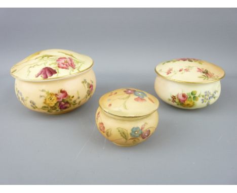 ROYAL WORCESTER - three blush floral lidded powder bowls of graduated size, 1912 and 1906, the smallest by Grainger and Co NO