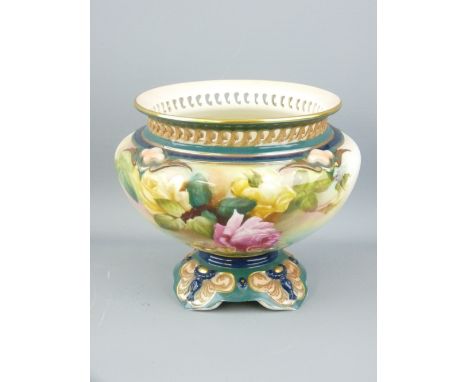 ROYAL WORCESTER - a glazed circular bowl on a shaped scroll decorated pedestal and having a pierced rim and with painted rose