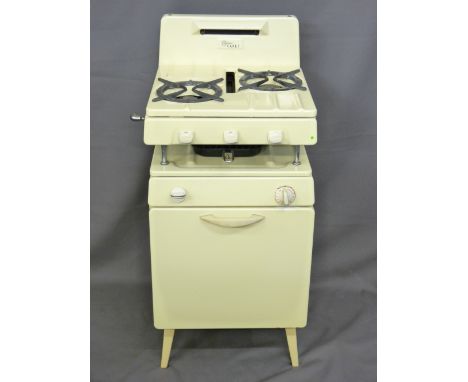 A NEW WORLD CADET VINTAGE GAS COOKER in cream enamel, 101cms height, 45cms width, 44cms depth