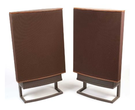 A pair of Quad electrostatic No. 63 ESL loud speakers, teak and brown fabric covers, on angular metal stands, floor-standing 