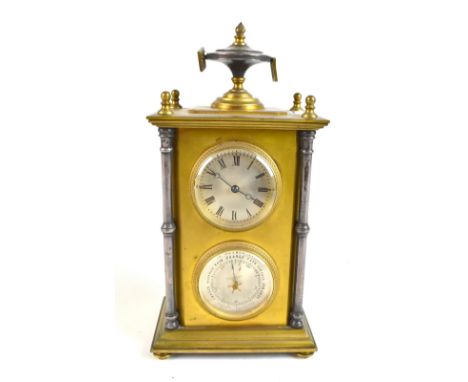 A gilt and silvered metal timepiece and barometer surmounted with an urn finial above rectangular body above silvered circula