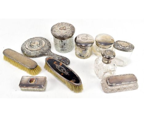 A quantity of silver dressing table items including glass trinket jars and covers, brushes, hand mirror, etc, various hallmar