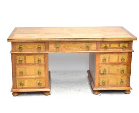 A Modern hardwood pedestal desk with stone panel inlay, six draws and one cupboard, width 165cm.  Additional InformationIt do