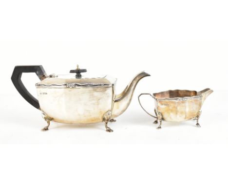 DUNCAN &amp; SCOBBIE; a George V hallmarked silver teapot and milk jug, Sheffield 1933, approx 31ozt/988g.