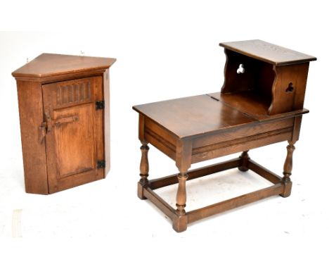 An oak corner cupboard with carved and panelled single door enclosing a single shelf, 56 x 49cm, and a telephone table (2).