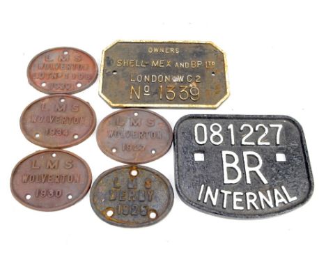 Seven cast metal railway plates comprising five L.M.S Wolverton 1925, 1927, 1930, 1934, 1939, an 'Owners Shell-Mex and BP Ltd