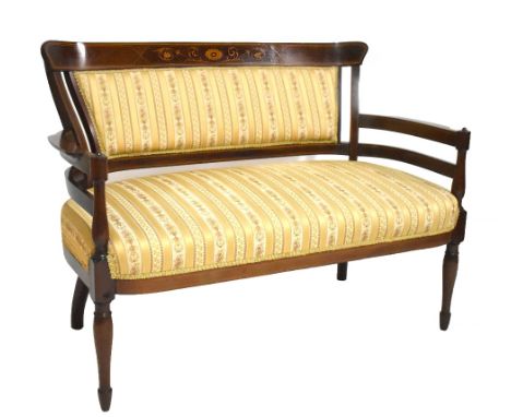 An Edwardian inlaid mahogany settee raised on column supports, width 118cm.