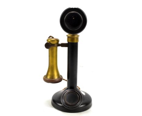 A brass mounted candlestick telephone, height 30cm.
