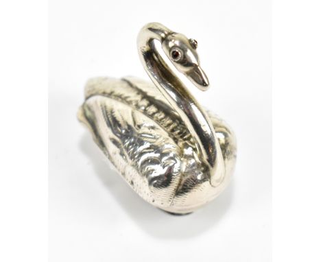 A late 19th century Dutch snuff box, modelled as a swan with red paste stone eyes, approx 0.5ozt/18g.