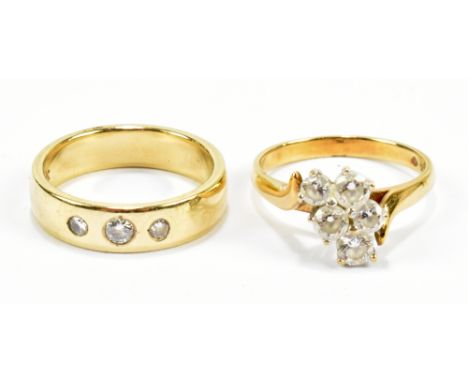 A 9ct yellow gold three stone diamond set ring, size M 1/2, and a 9ct yellow gold dress ring, size N, combined approx 7.5g (2