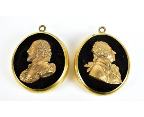 A pair of 19th century profile busts set in oval brass frames, the first depicting William Shakespeare, each with ring loop a