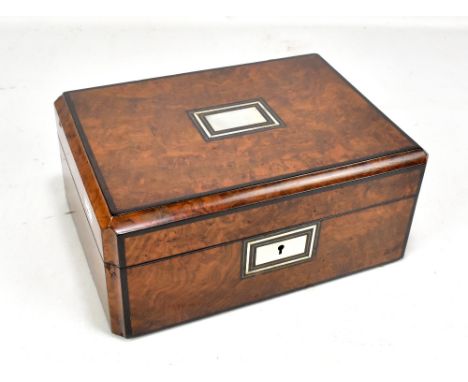 A Victorian burr walnut rectangular sewing box, the cover inlaid with a mother of pearl panel enclosing fitted compartments, 