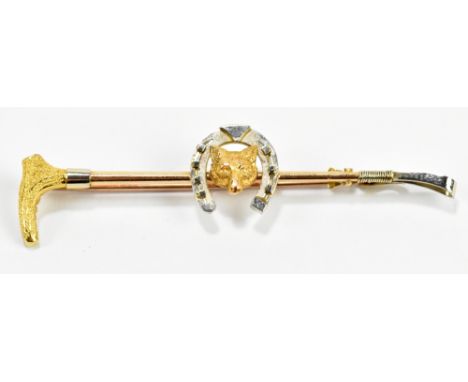 A 15ct yellow gold hunting brooch, in the form of rider's crop, with a horse shoe and fox's head central, approx 3.3g.