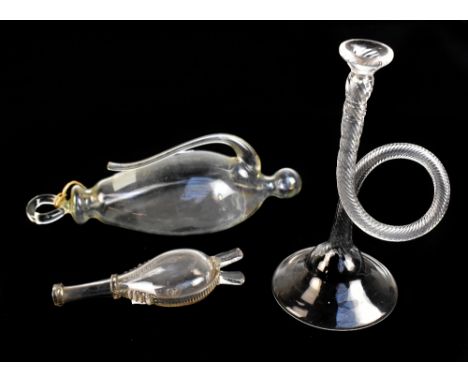 A 19th century French clear glass barometer, a novelty glass horn and a novelty glass flask in the form of a pair of bellows 