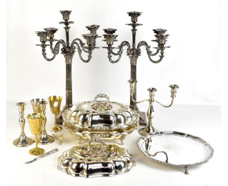ELKINGTON &amp; CO; a pair of Victorian silver plated candelabra and a pair of Henry Wilkinson &amp; Co silver plated lidded 