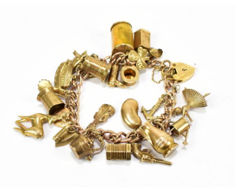 A 9ct yellow gold charm bracelet set with numerous charms including a pistol, accordion, Noah’s ark, banjo, etc, approx 39.7g