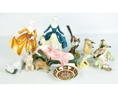 A group of mixed ceramic figures to include three Royal Doulton ladies, HN2709, H2278 and HN2381, also Royal Worcester birds,