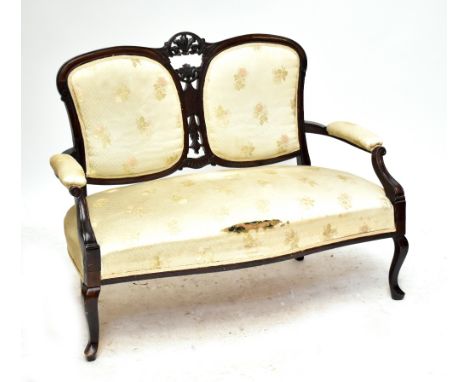 An Edwardian mahogany upholstered two seater sofa with carved back on front cabriole legs, length 122cm (af).