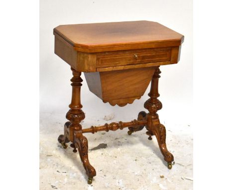 A 19th century mahogany sewing box/games table, the hinged cover enclosing chess, backgammon and cribbage boards above single