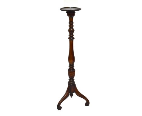 An early 20th century mahogany torchère on tripod support, height 122cm.