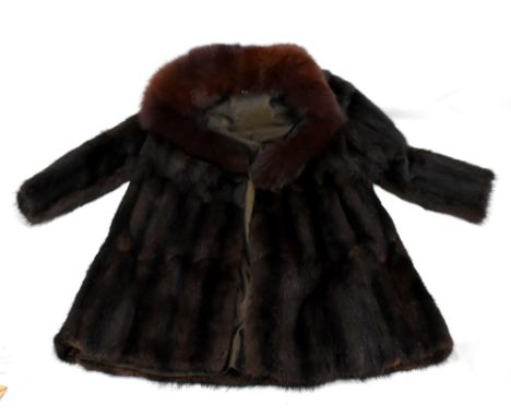 A mink dyed fur coat with fox fur collar.