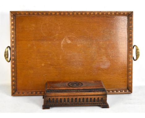 A rectangular oak and brass twin handled tray, 38 x 55cm, and an oak carved trinket box (2).