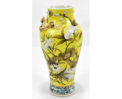 A late 19th/early 20th century Chinese yellow ground vase decorated with dragons amongst flowers, unmarked, height 22cm.Addit