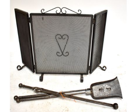 A folding fireguard and a set of companion tools.