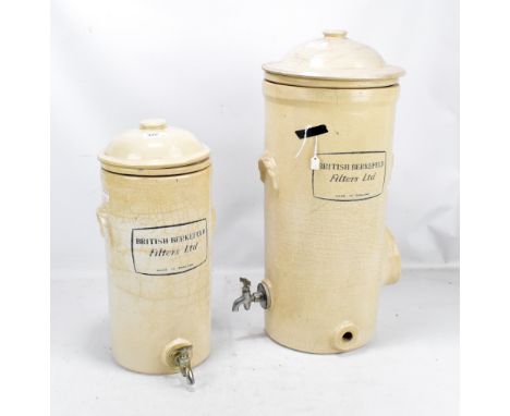 BRITISH BERKEFELD FILTERS LTD; two ceramic filters with printed detail and taps, height of largest approx 58cm (lid af) (2).A