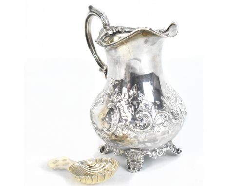 HENRY HOLLAND; a Victorian hallmarked silver repoussé decorated jug, London 1868, height 13.5cm, approx 7.1ozt/222g, also a m