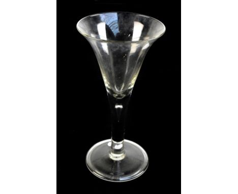 A 19th century oversized drinking glass with flared trumpet bowl and folded foot, height 25cm.Additional InformationLight gen