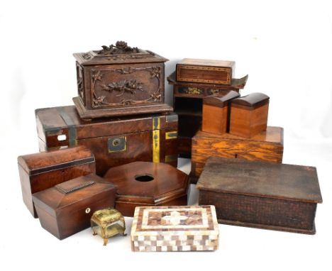 A group of treen boxes including a carved Black Forest two division tea caddy, a Tunbridge ware work box (af), and a writing 