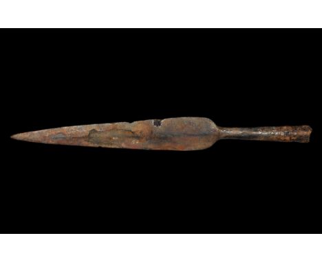 5th-1st century BC. A hand-forged iron spearhead of La Tène I type with narrow leaf-shaped blade lentoid in section, tubular 