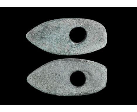 Neolithic, 5th-2nd millennium BC. A pecked and ground axe-hammer with central perforation for hafting, showing to one side an