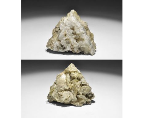 . A specimen of bladed baryte crystals on matrix, with quartz crystals on the underside, and bearing an old paper adhesive la